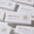 Mesoten D DMAE product boxes arranged in a minimalist skincare product layout