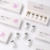 Flat lay of Mesoten H hyaluronic acid ampoules and white branded product boxes