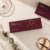 Mesoten NAD+ Premium box displayed on a burgundy pedestal for a luxury product gallery