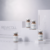 Revacoll collagen powder vials arranged on white studio pedestals