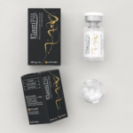 Flat lay of ElastiFill AKRADEX box, vial and white pellets on a clean light background