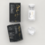 Flat lay of ElastiFill AKRADEX box, vial and white pellets on a clean light background