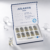 Open Atlantis Hair scalp treatment kit containing 10 vials and soothing moisturiser