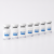Lennea Booster 3ml vials lined up in a minimal white studio setting